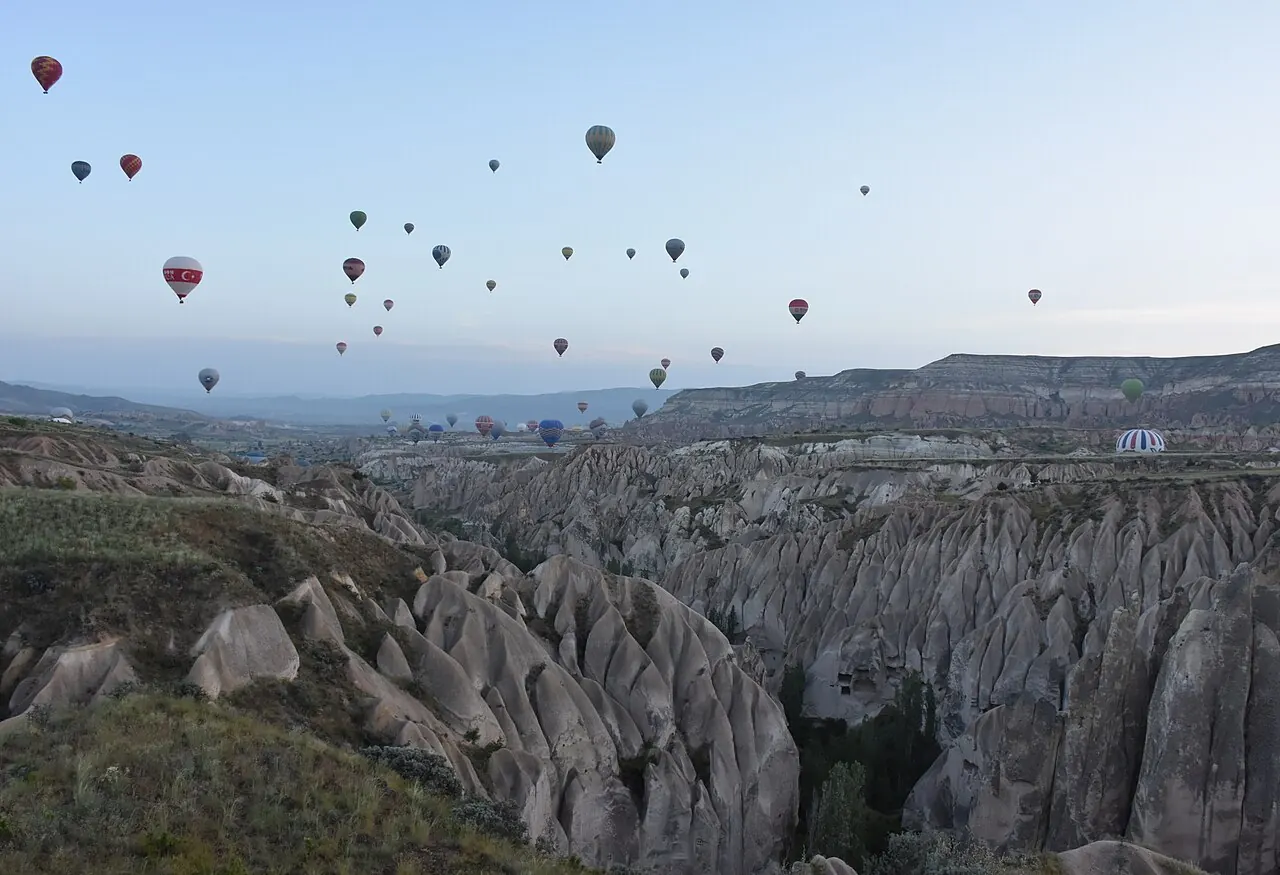 Hot air balloons over the valleys near Göreme, Cappadocia, at dawn