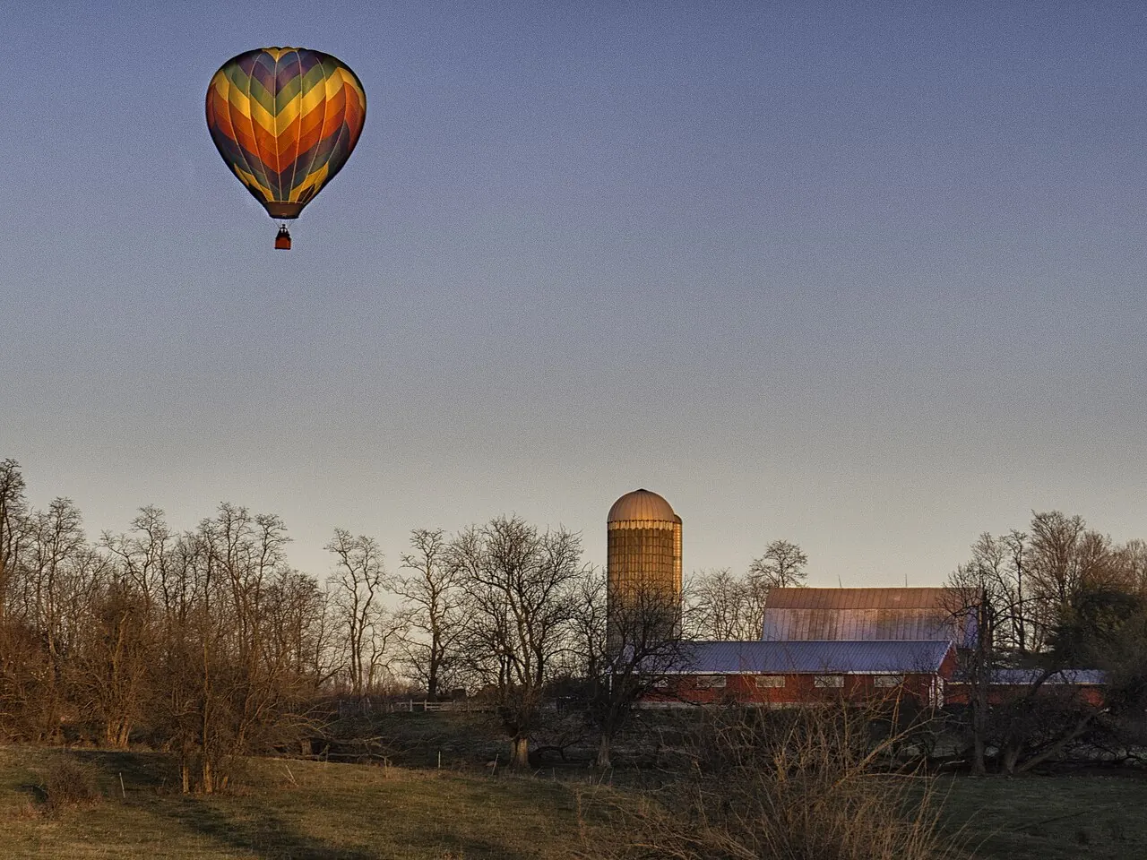 A hot air balloon over a farm in Ohio
